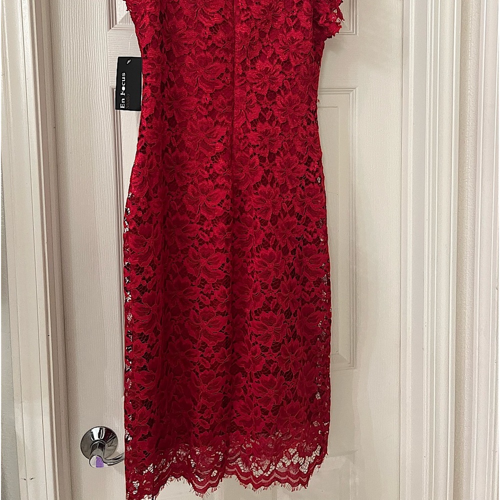 Red Lace Dress, below the knee. New tags are attached. The maker is En Focus